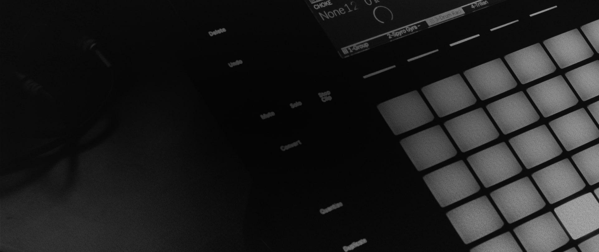 A black and white photo of a midi pad controller.