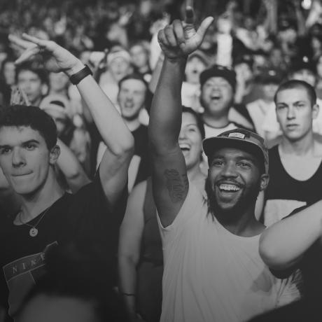 A black and white photo of people at a concert.