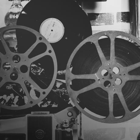 A black and white photo of a reel of film.