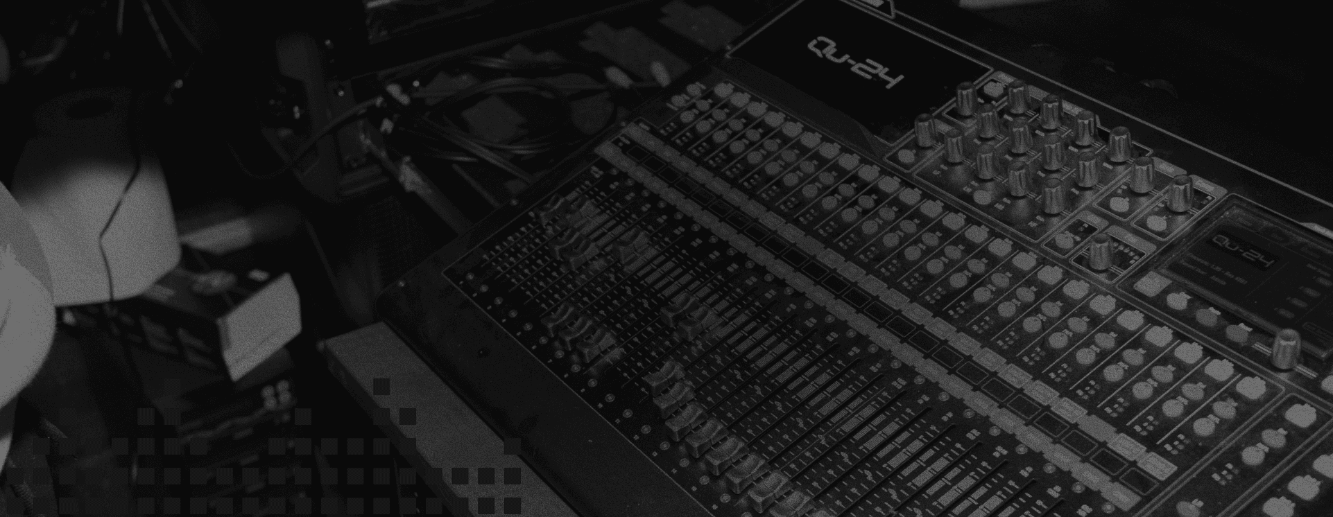 A black and white photo of a mixing board.