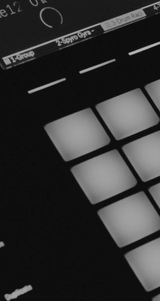 A black and white photo of a midi pad controller.